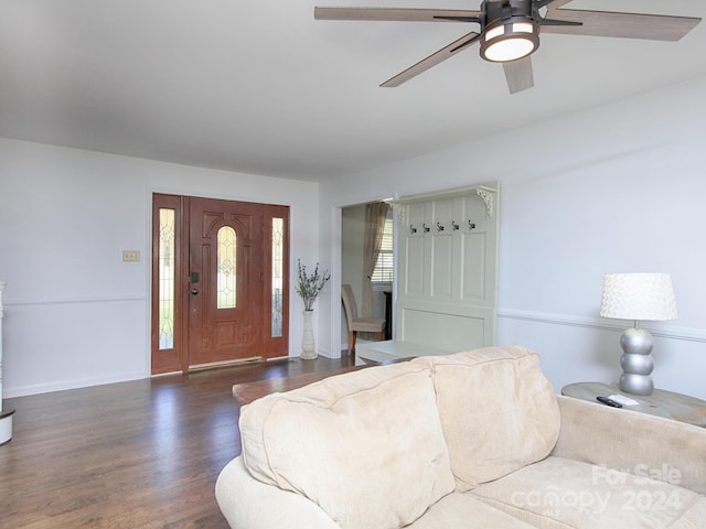 foyer entrance with dark hardwood / wood-style flooring and ceiling fan