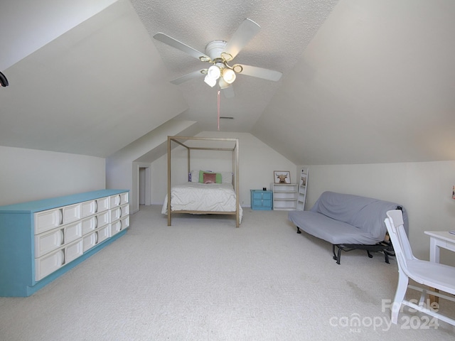 bedroom featuring a textured ceiling, carpet, ceiling fan, and vaulted ceiling