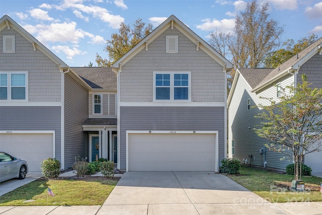 view of front of house featuring concrete driveway and a garage