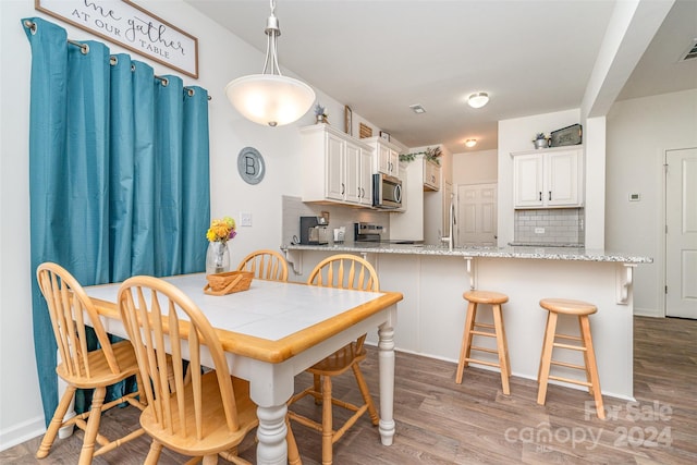 14034 Clayborn St Unit 28, Midland, NC 28107 - dining area featuring light wood finished floors and visible vents