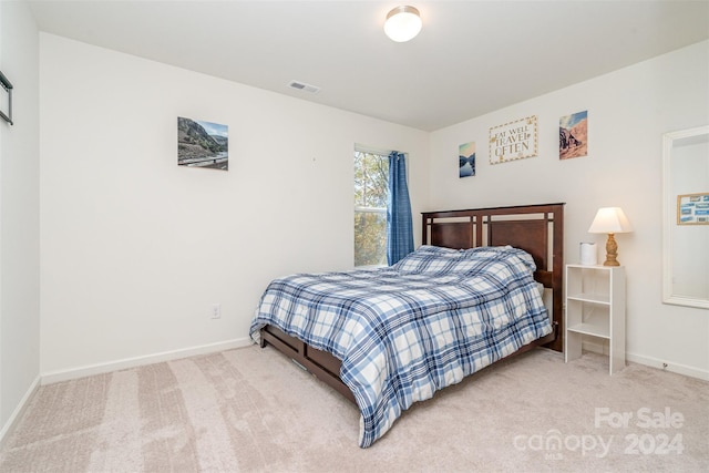 bedroom featuring carpet, visible vents, and baseboards