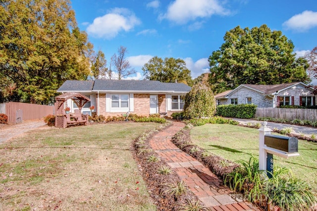 ranch-style house with a front lawn