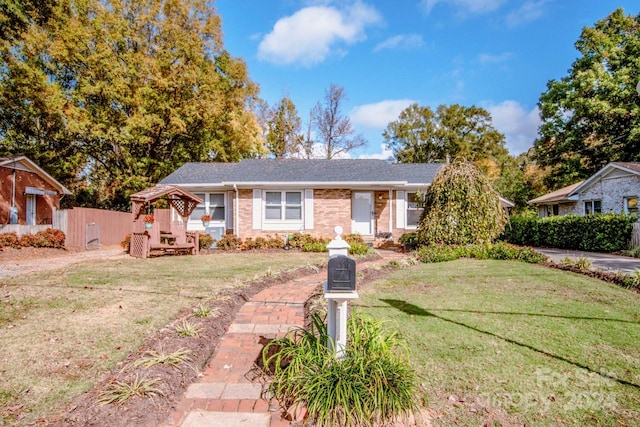 single story home with a front yard