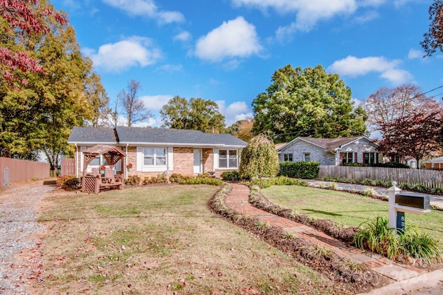 single story home with a front yard