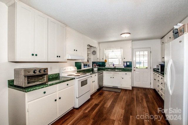 kitchen with white cabinetry, stainless steel appliances, dark wood-type flooring, and a textured ceiling