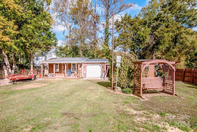 view of front of property featuring a front yard and a garage