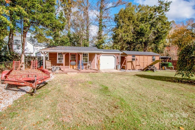 back of house featuring a storage shed and a yard