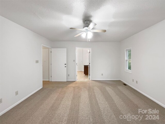 1259 Blacksnake Rd, Stanley, NC 28164 - spare room with ceiling fan, baseboards, and light carpet