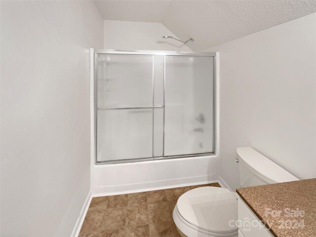 1259 Blacksnake Rd, Stanley, NC 28164 - full bathroom with vaulted ceiling, toilet, combined bath / shower with glass door, baseboards, and vanity