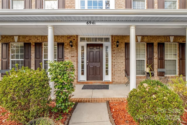 doorway to property featuring a porch