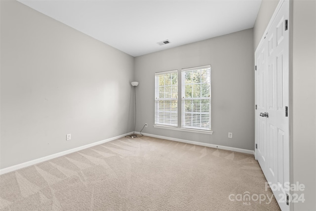 unfurnished bedroom featuring carpet