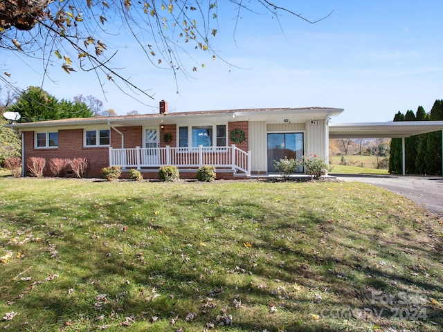 single story home with a front lawn, a porch, and a carport