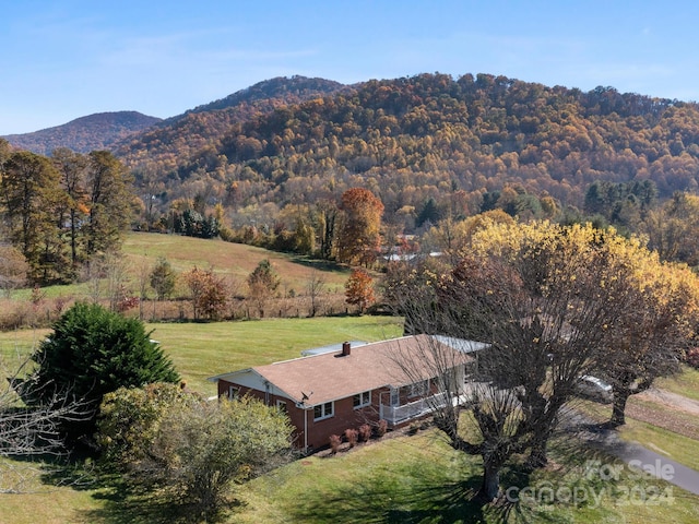 drone / aerial view with a mountain view and a rural view