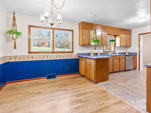 kitchen with dishwasher, light wood-type flooring, a chandelier, and a healthy amount of sunlight