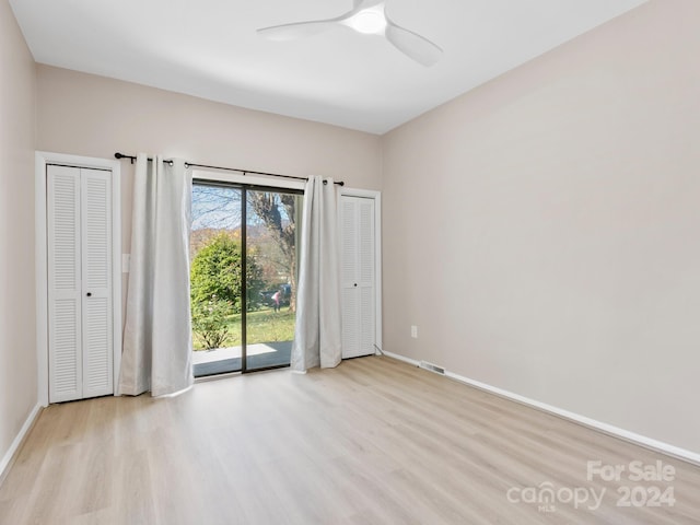 unfurnished bedroom featuring ceiling fan, light hardwood / wood-style floors, and access to outside