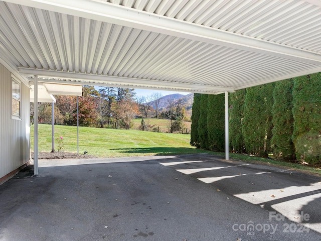 view of patio featuring a carport and a mountain view