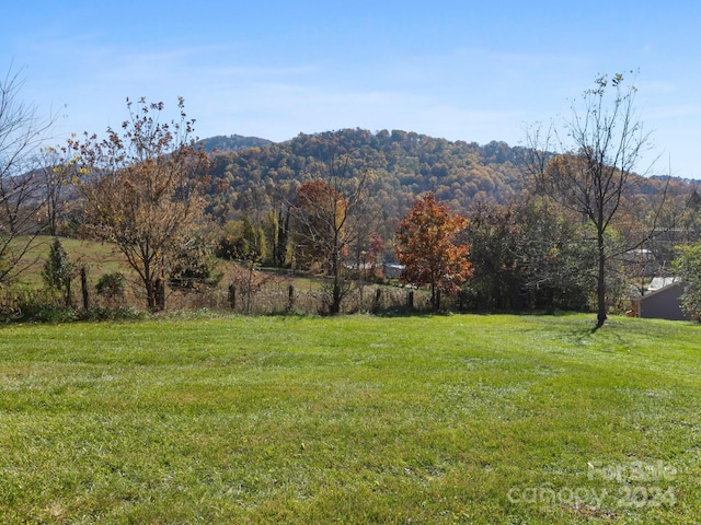 mountain view featuring a rural view