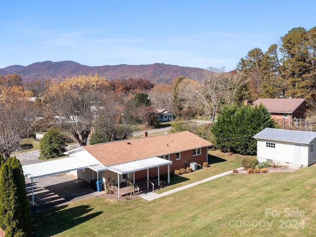 birds eye view of property featuring a mountain view