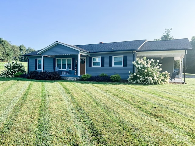 single story home with covered porch and a front lawn