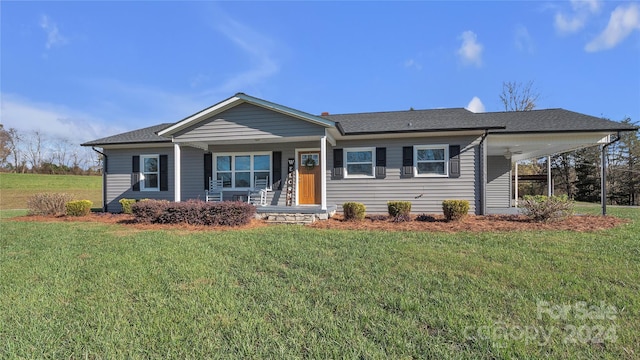 ranch-style home with a front yard, a porch, and a carport