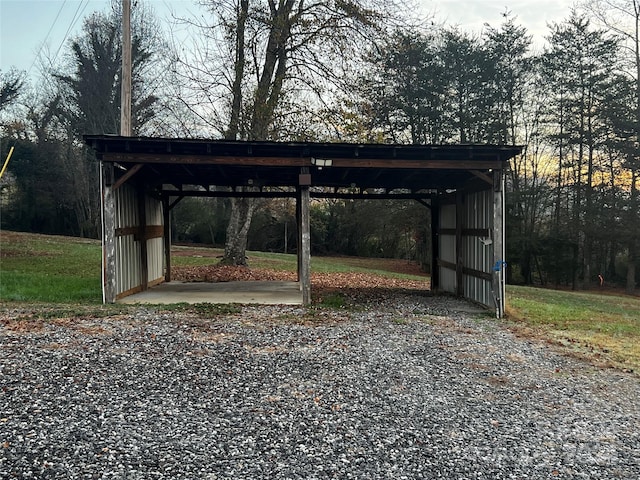 view of parking / parking lot featuring a carport