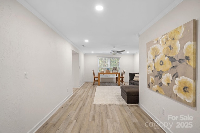 hall featuring ornamental molding and light wood-type flooring