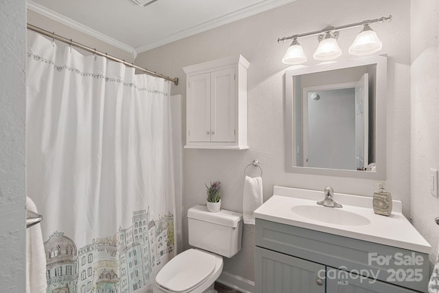 bathroom with a shower with curtain, ornamental molding, vanity, and toilet