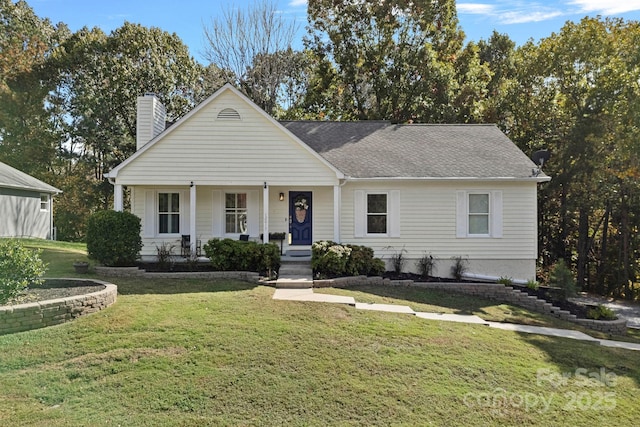 view of front of house with covered porch and a front lawn