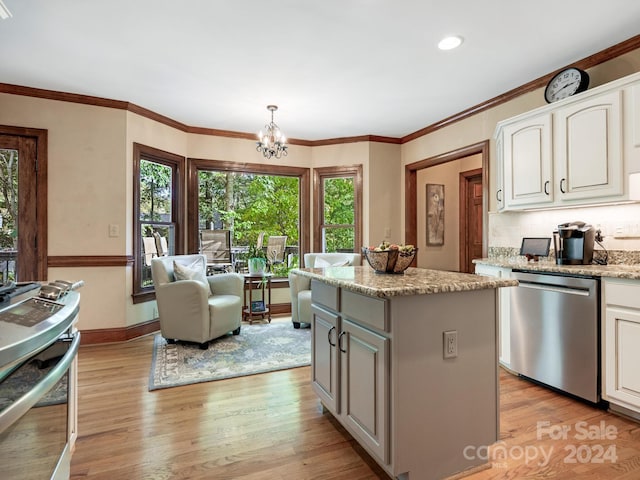 kitchen featuring light wood-type flooring, dishwasher, pendant lighting, and a kitchen island