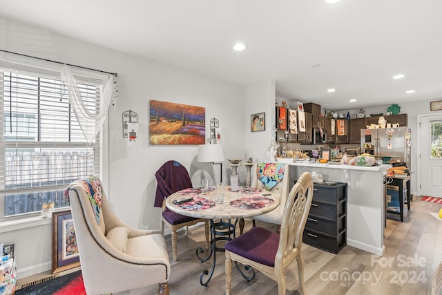 dining space featuring light hardwood / wood-style flooring