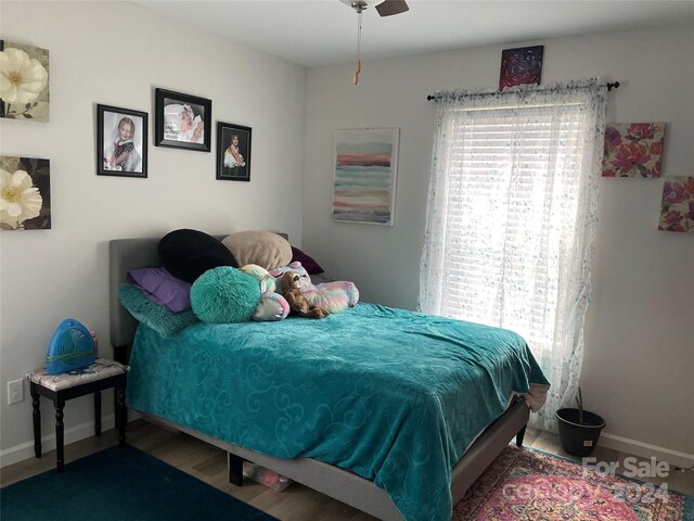 bedroom featuring ceiling fan and hardwood / wood-style floors