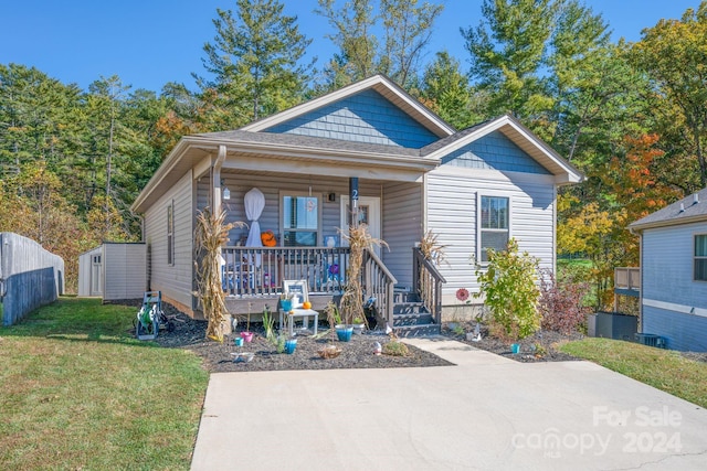 bungalow with a front lawn and a porch