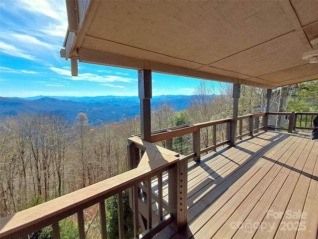 wooden terrace with a mountain view