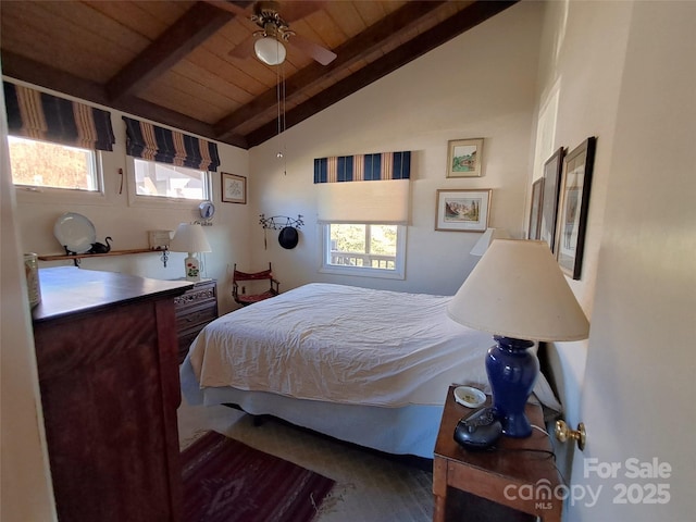 bedroom with ceiling fan, wooden ceiling, and vaulted ceiling with beams