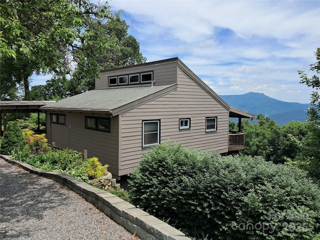 view of home's exterior featuring a mountain view