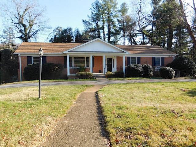 view of front of home with a front lawn and a porch