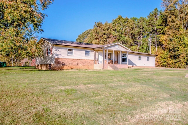 view of front of home featuring a porch and a front yard