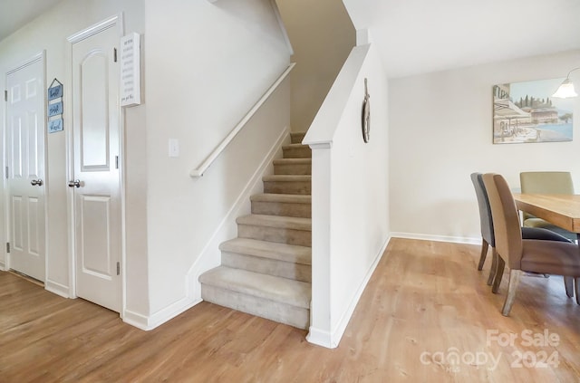 stairway featuring hardwood / wood-style floors