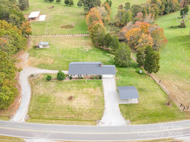 birds eye view of property featuring a rural view