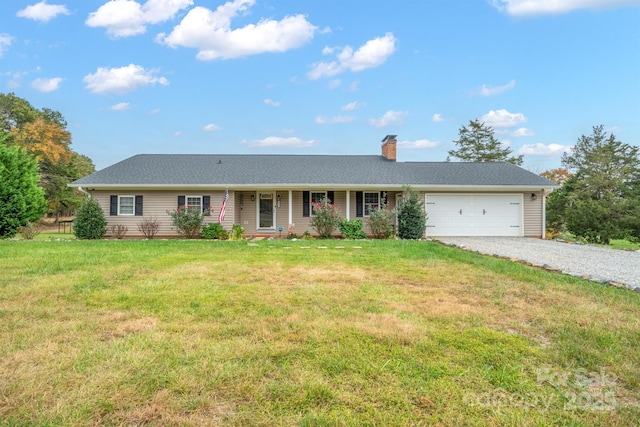 ranch-style home with a front lawn and a garage