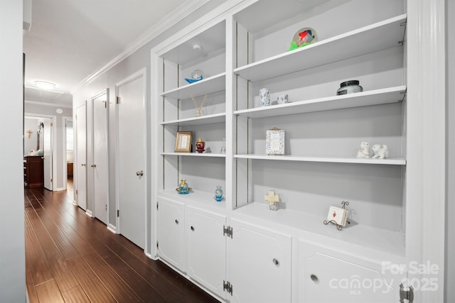 hallway featuring crown molding and dark hardwood / wood-style floors