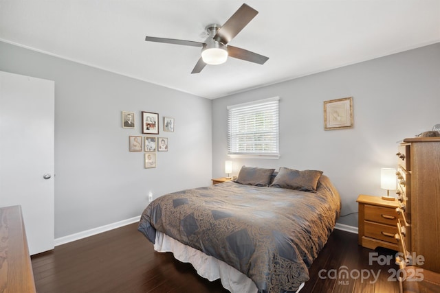 bedroom with ceiling fan and dark hardwood / wood-style floors