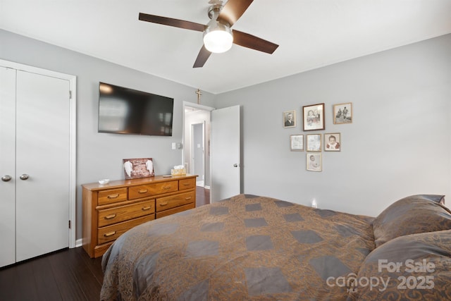 bedroom featuring a closet, ceiling fan, and dark hardwood / wood-style floors