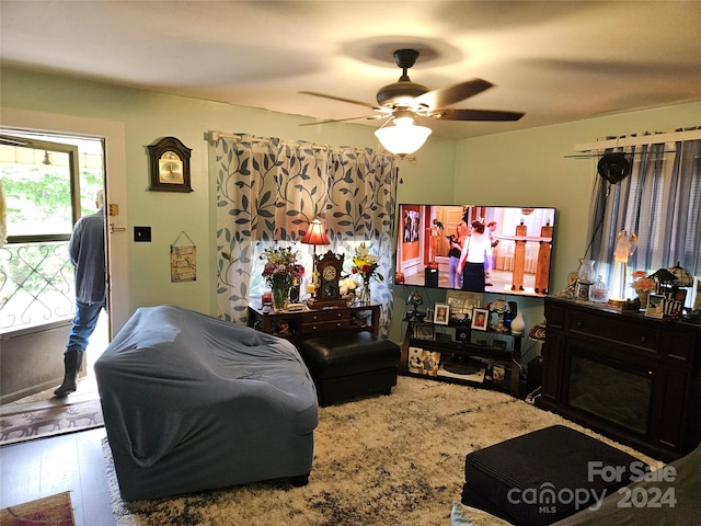 interior space with wood-type flooring and ceiling fan