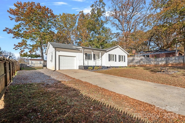 view of front facade with covered porch and a garage