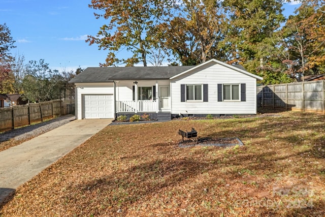 single story home featuring a front lawn and a garage