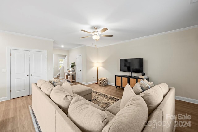 living room with crown molding, hardwood / wood-style flooring, and ceiling fan