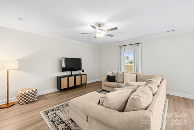 living room with ornamental molding, hardwood / wood-style floors, and ceiling fan