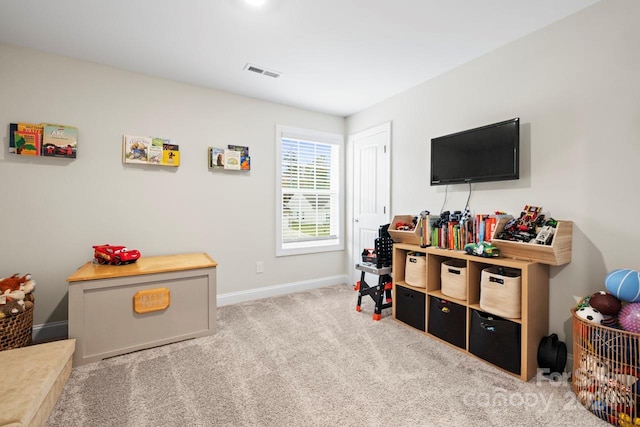 game room with light colored carpet