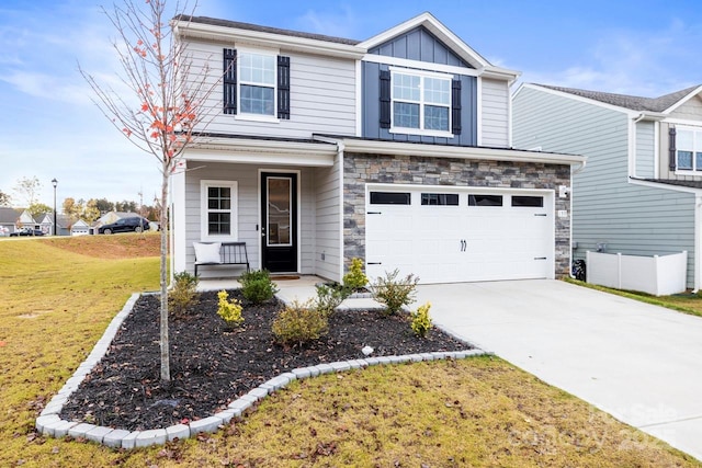 view of front of home featuring a porch, a garage, and a front lawn